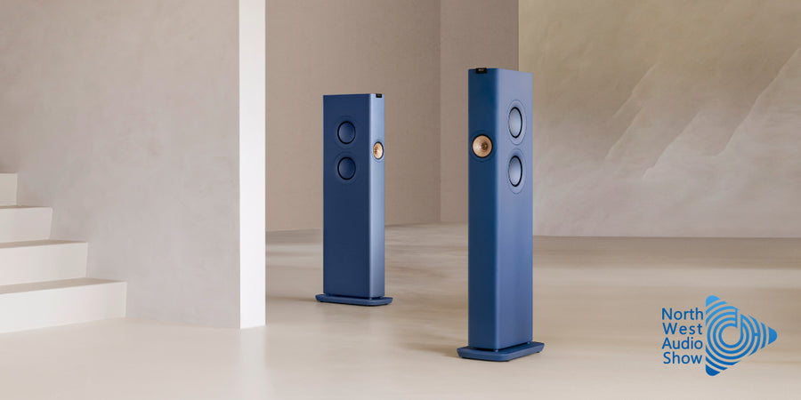 KEF LS60 Wireless speakers in Royal Blue with a logo for North West Audio Show