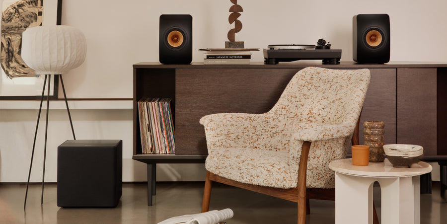 How do I integrate my subwoofer with my wireless speakers?