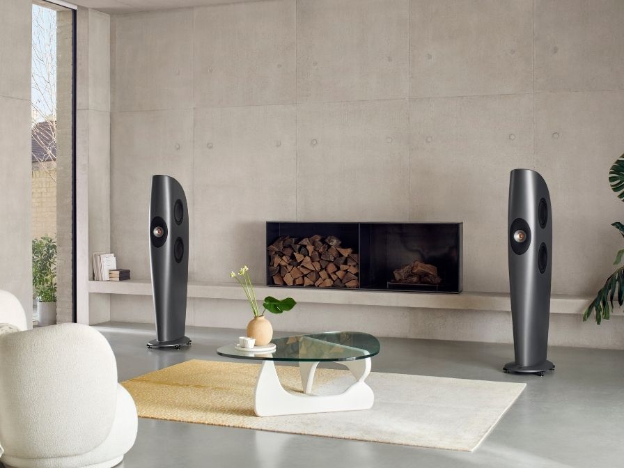 Blade One Speakers in living room with fireplace.